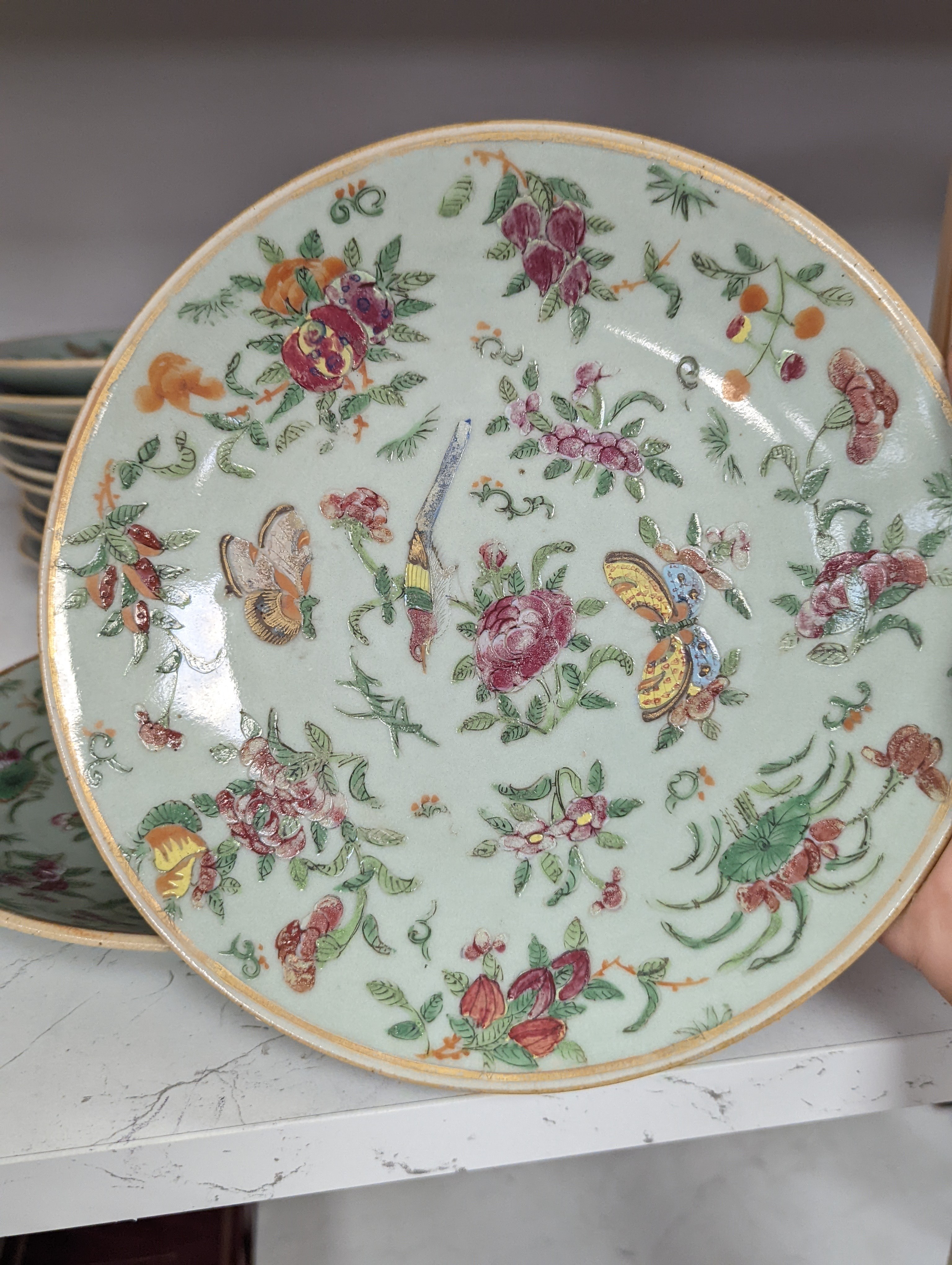 Eleven Chinese celadon ground famille rose plates, mid 19th century 22cm